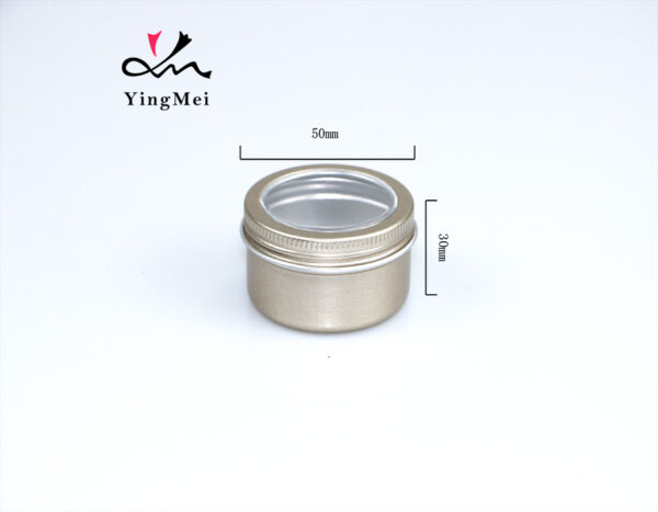 gold round aluminum storage jar with transparent lid