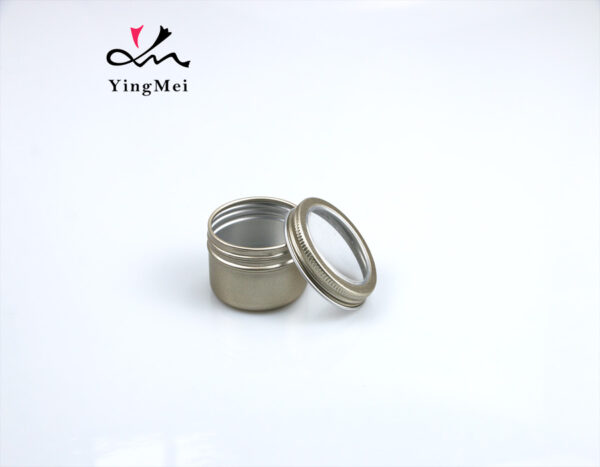 gold round aluminum storage jar with transparent lid