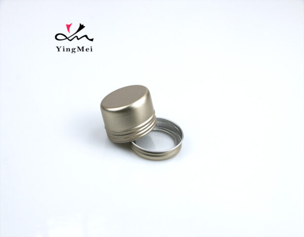 gold round aluminum storage jar with transparent lid