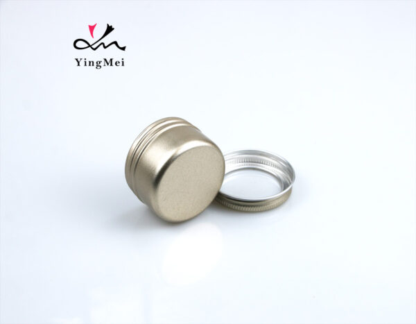 gold round aluminum storage jar with transparent lid