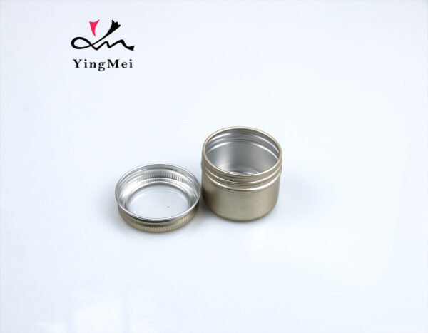 gold round aluminum storage jar with transparent lid