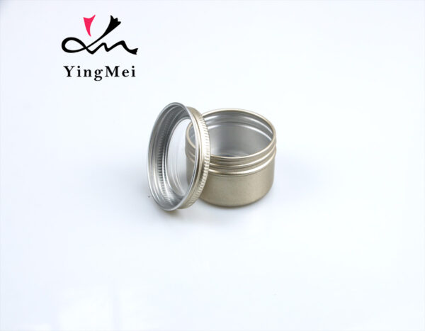 gold round aluminum storage jar with transparent lid